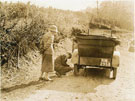 View: ct11719 Man removing chains from car tyre