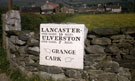 View: ct21474 Cartmel - road sign set into a wall